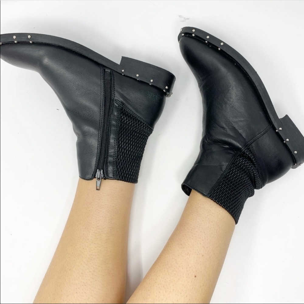 EUC black leather bootie with studs.